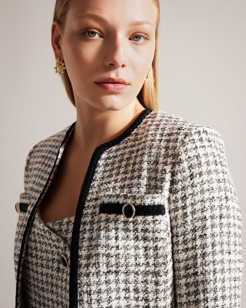 LYRRA-Jackets-Check into the week in style. Featuring a classic dogtooth pattern and contrast trims, LYRRA adds a touch of understated elegance to any outfit. Front pockets and decorative buttons complete the look, with an open front design for easy layering. Boucle jacket Dogtooth pattern Contrast trims Front pockets Decorative buttons Open front- Ted Baker Romania